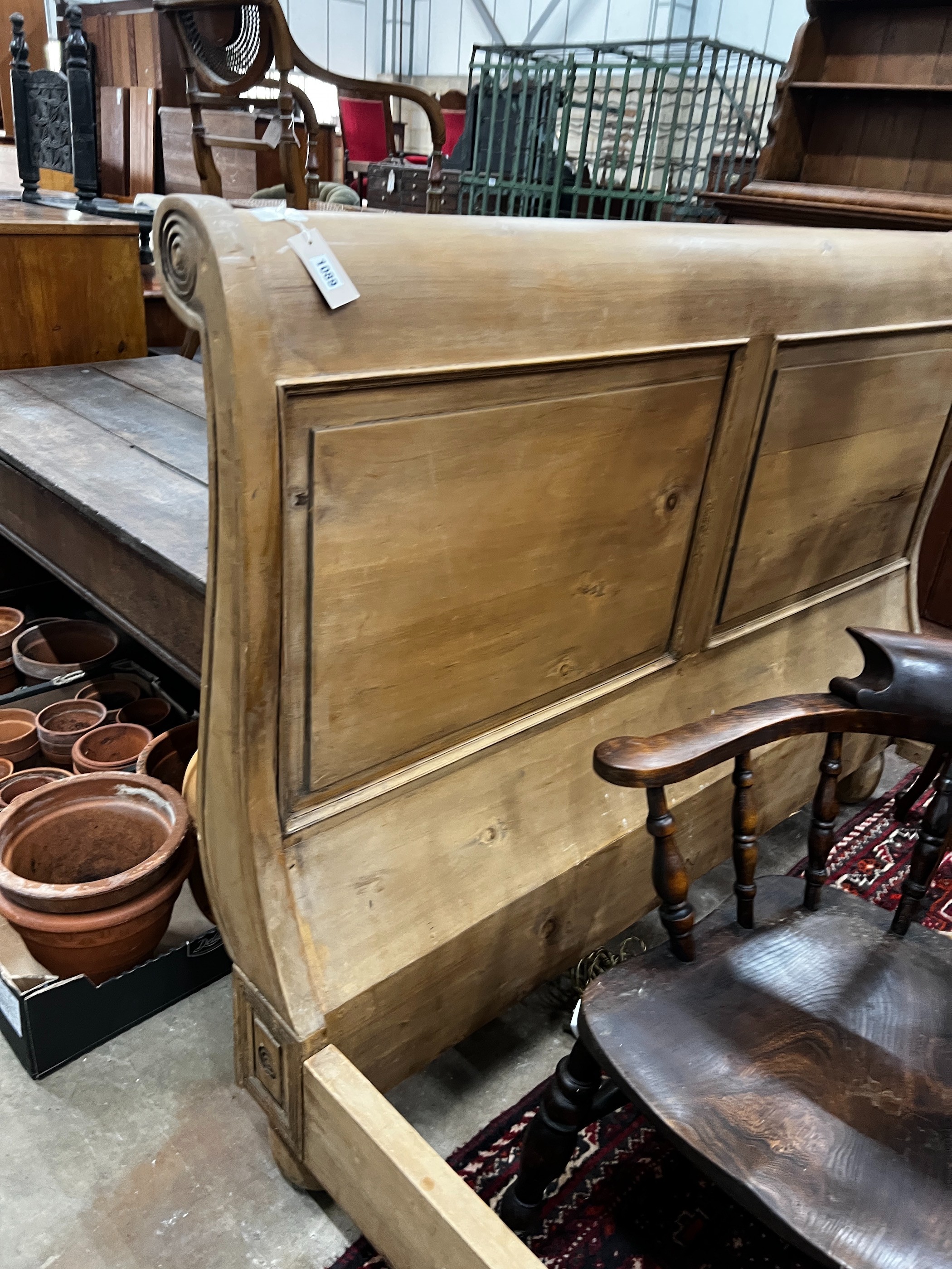 A pine sleigh bed frame, width 161cm, length 240cm, height 120cm